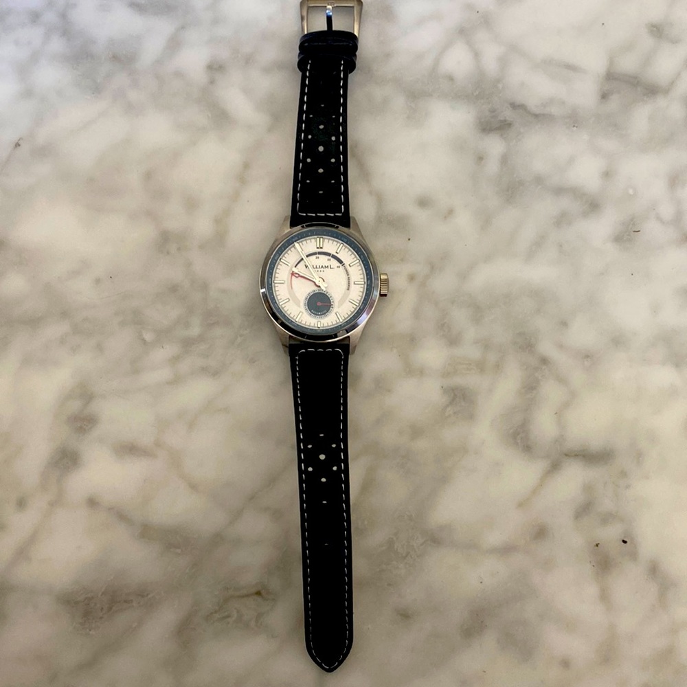 William L Power Reserve black leather watch. Brand new comes brand new with box.